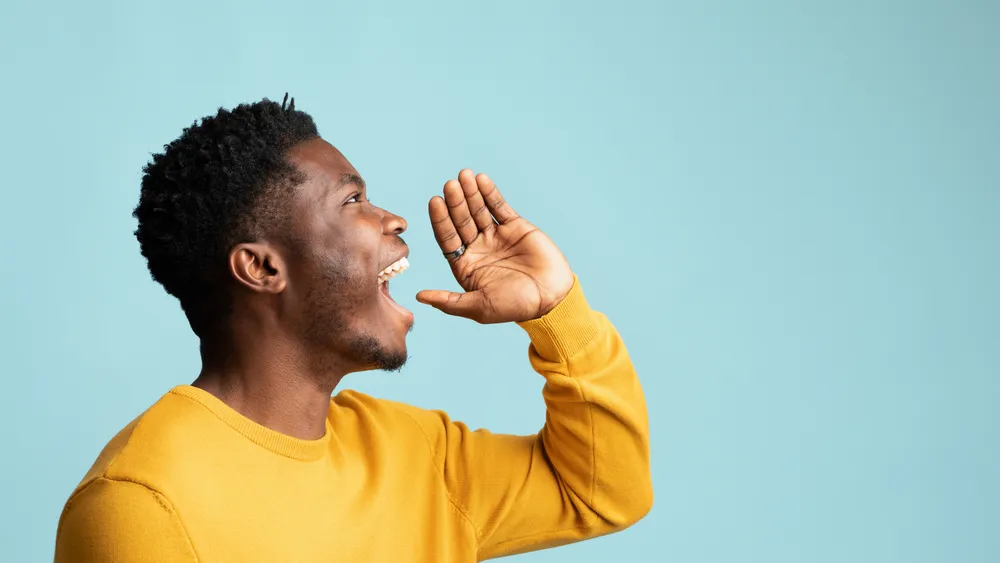 Person speaking confidently and expressively — accent and pronunciation in focus